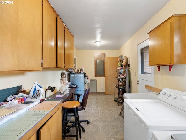 laundry room with cabinets, electric panel, sink, water heater, and washer / clothes dryer