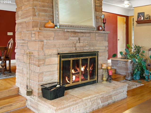 interior details with a fireplace and hardwood / wood-style flooring