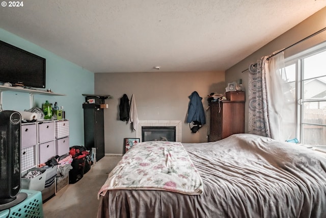 carpeted bedroom featuring a textured ceiling