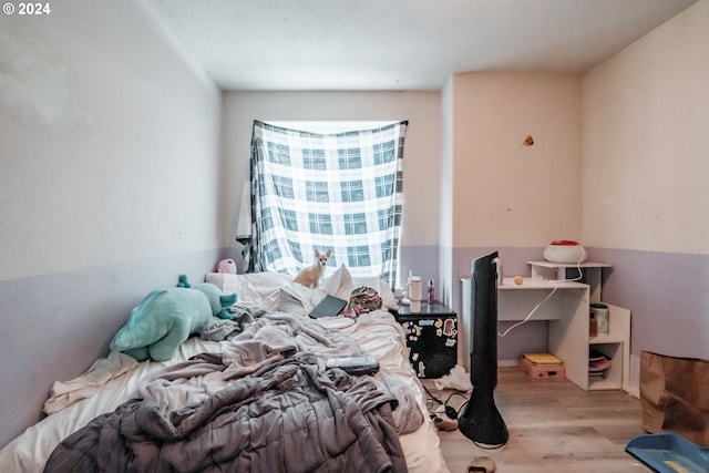 bedroom with light hardwood / wood-style floors