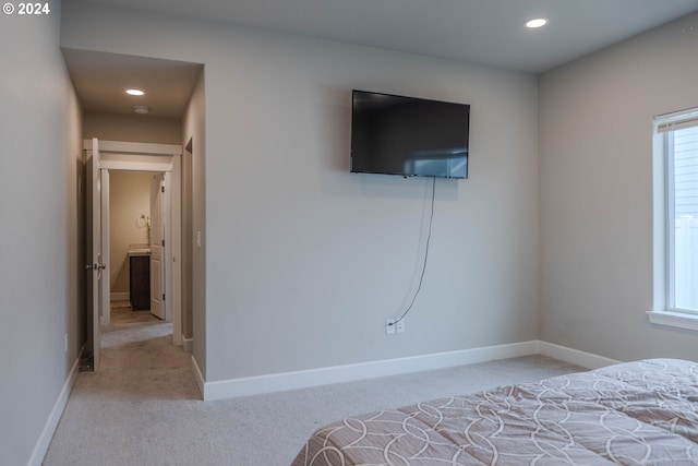 carpeted bedroom with recessed lighting and baseboards