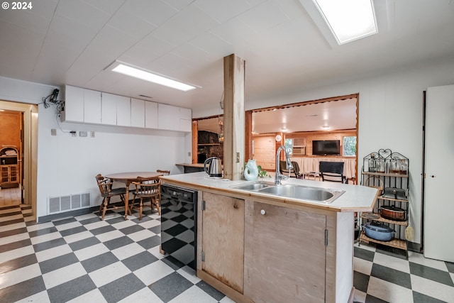 kitchen with dishwasher, tile patterned floors, and sink