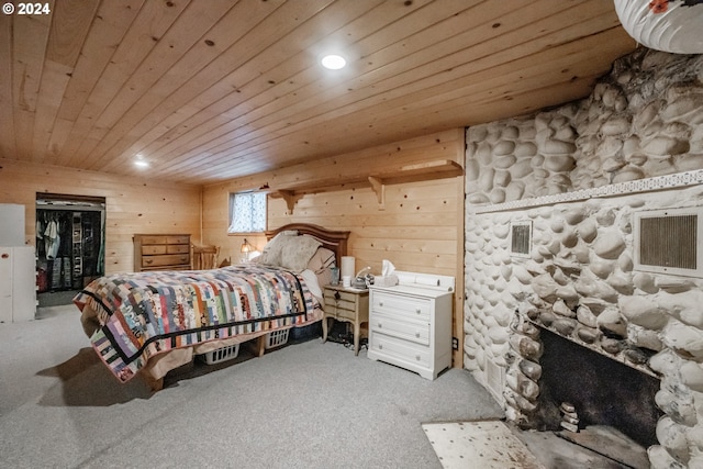 bedroom with wood walls, wood ceiling, and carpet floors