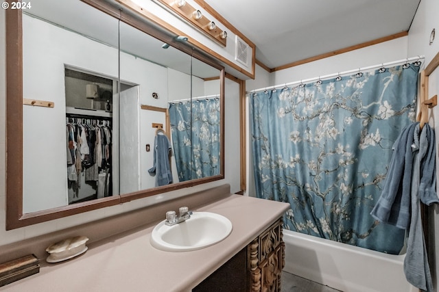 bathroom featuring shower / bathtub combination with curtain and vanity