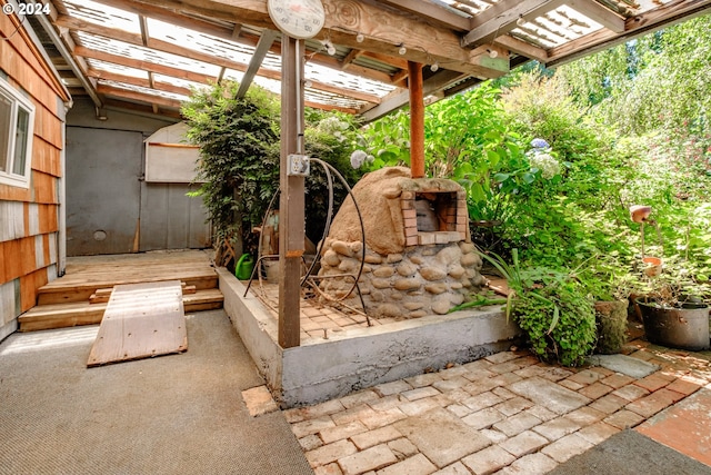 view of patio with a pergola and a deck