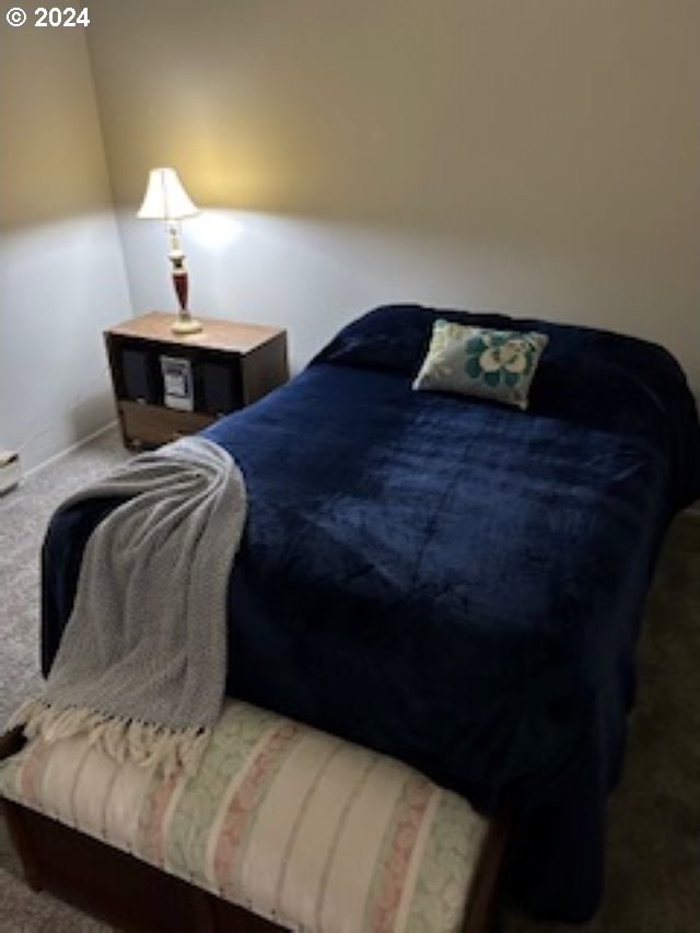 carpeted bedroom with baseboards