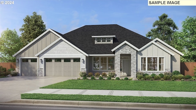 view of front of property with a front yard and a garage