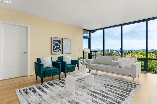 living room with hardwood / wood-style floors and expansive windows