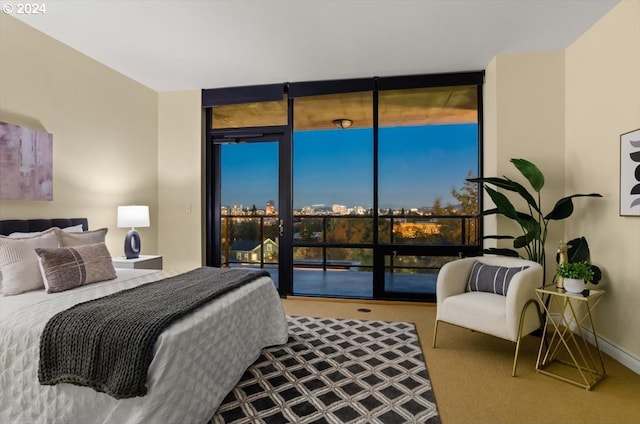 2442 NW Westover Rd Unit 3-202, Portland, OR 97210 - bedroom featuring expansive windows and access to exterior