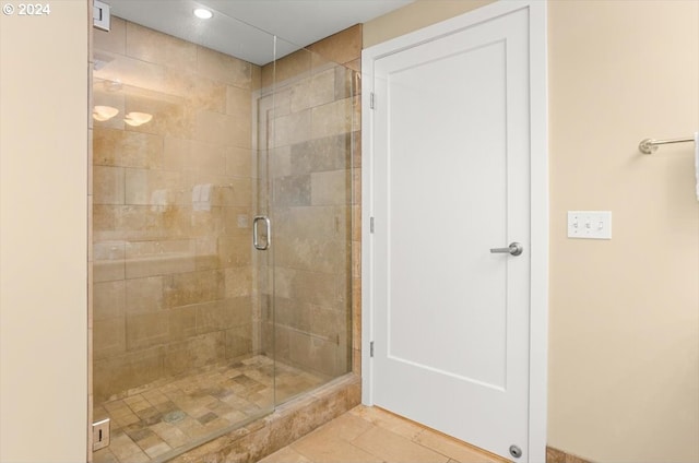 bathroom featuring tile patterned flooring and walk in shower