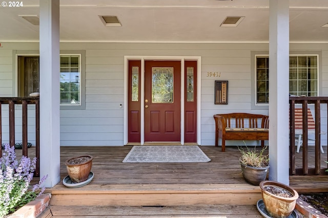 property entrance featuring covered porch