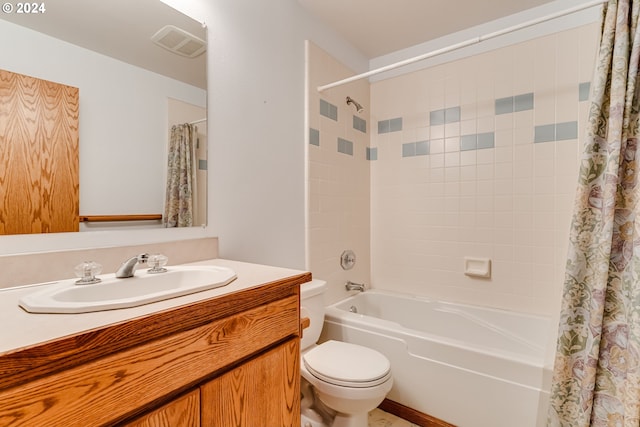 full bathroom featuring vanity, toilet, and shower / bath combo with shower curtain