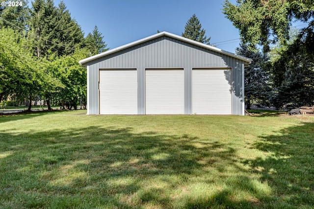 garage featuring a yard