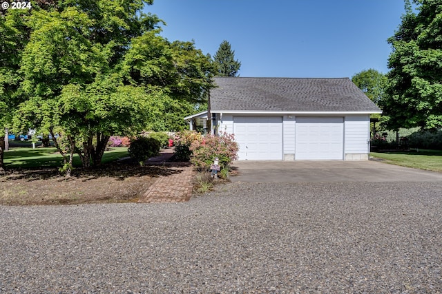 view of front of house with an outbuilding and a garage