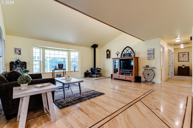 39431 Walterville Ln, Springfield, OR 97478 - living area with a wood stove, light wood-style floors, and vaulted ceiling