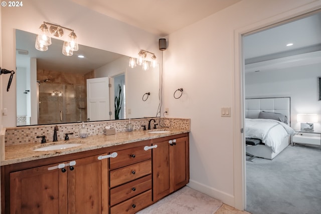 bathroom featuring vanity and a shower with door