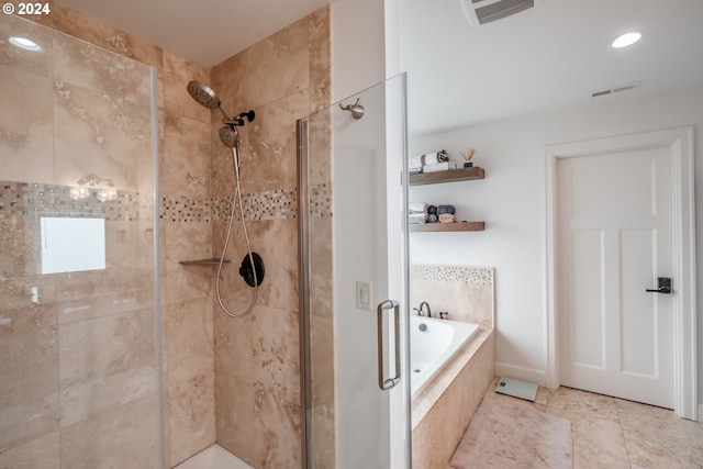 bathroom with plus walk in shower and tile patterned flooring