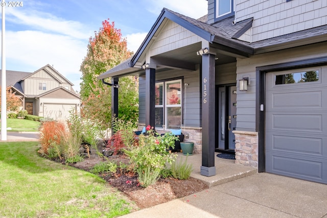 view of exterior entry featuring a garage