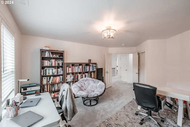 carpeted office space with a chandelier