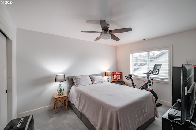 bedroom with carpet flooring, ceiling fan, and a closet