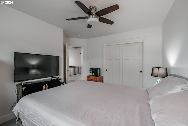 bedroom with ceiling fan, a closet, and carpet floors