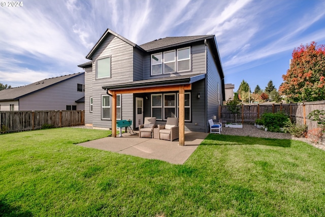 rear view of house with a patio area and a yard