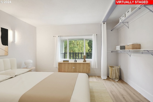 bedroom featuring light wood-type flooring