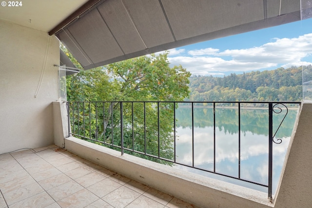 balcony featuring a water view