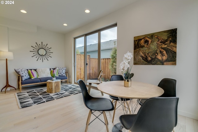 dining space featuring light hardwood / wood-style floors