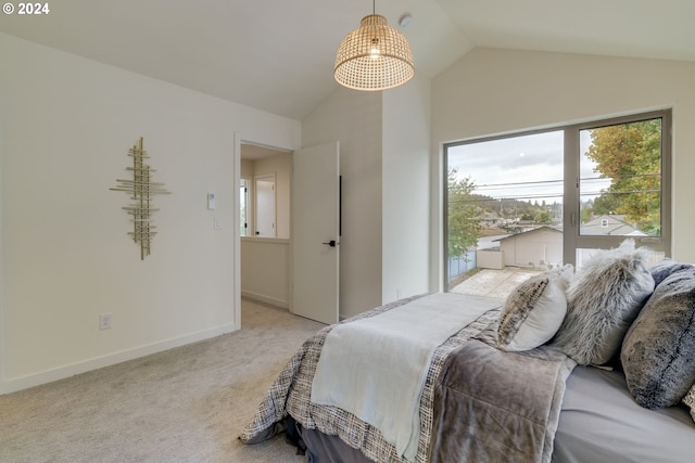 carpeted bedroom featuring lofted ceiling