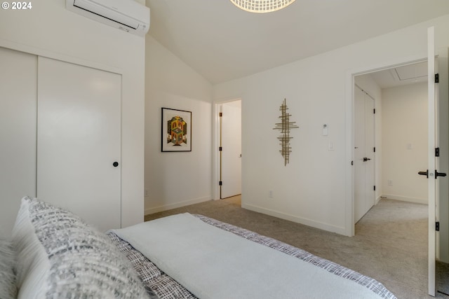 carpeted bedroom featuring vaulted ceiling, a closet, and an AC wall unit