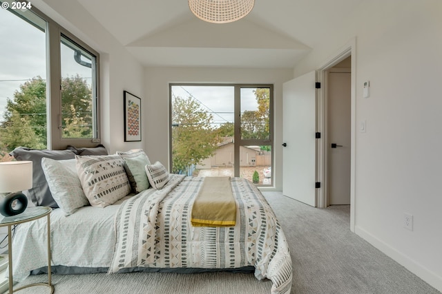 carpeted bedroom with vaulted ceiling