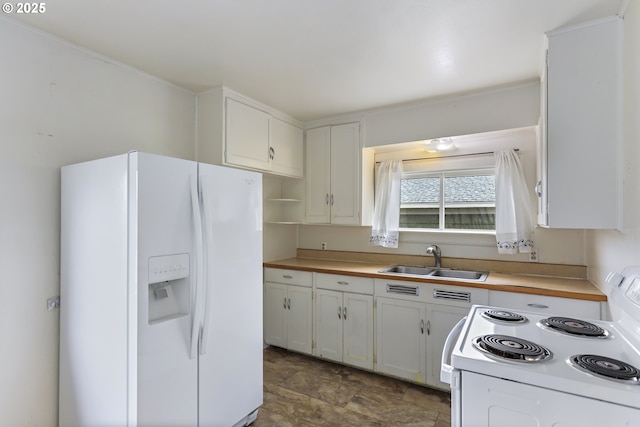 kitchen featuring a sink, white appliances, white cabinetry, and light countertops