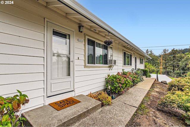 entrance to property featuring cooling unit