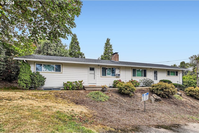 single story home featuring a front lawn