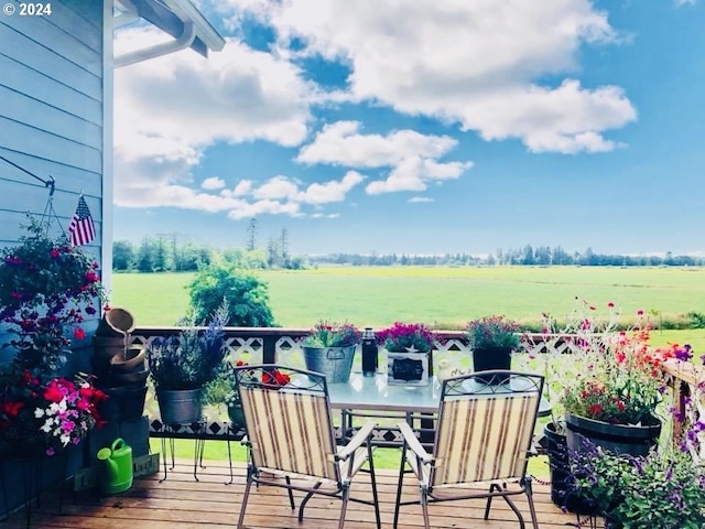 wooden terrace with a rural view