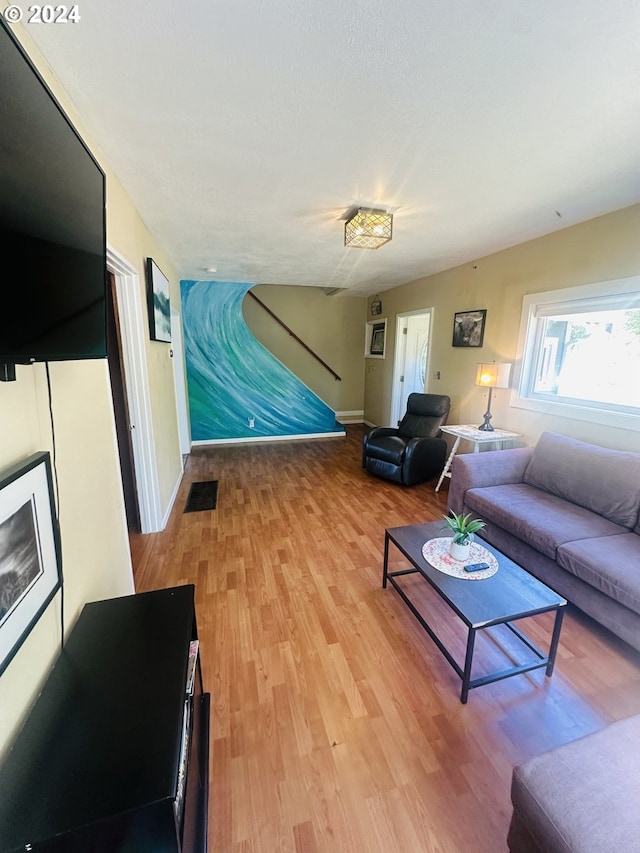 living room with light hardwood / wood-style flooring