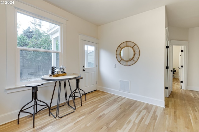 dining room with light hardwood / wood-style floors