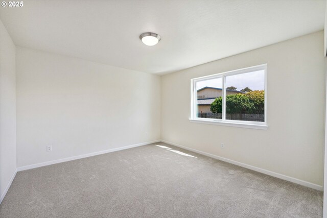 655 11th St SW, Bandon, OR 97411 - carpeted spare room with baseboards