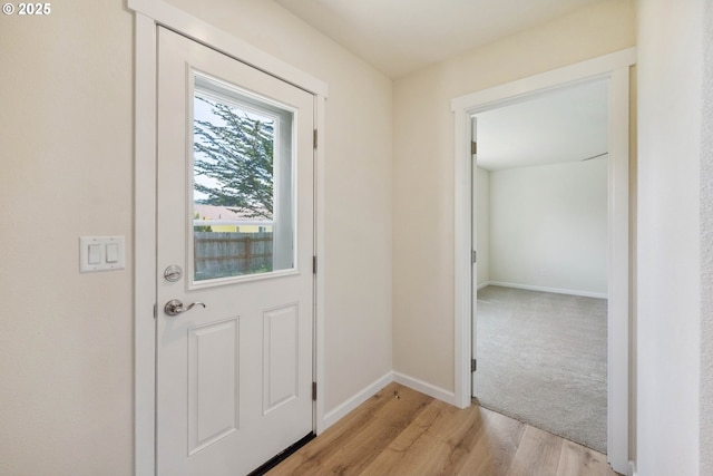 655 11th St SW, Bandon, OR 97411 - doorway to outside with light wood finished floors and baseboards