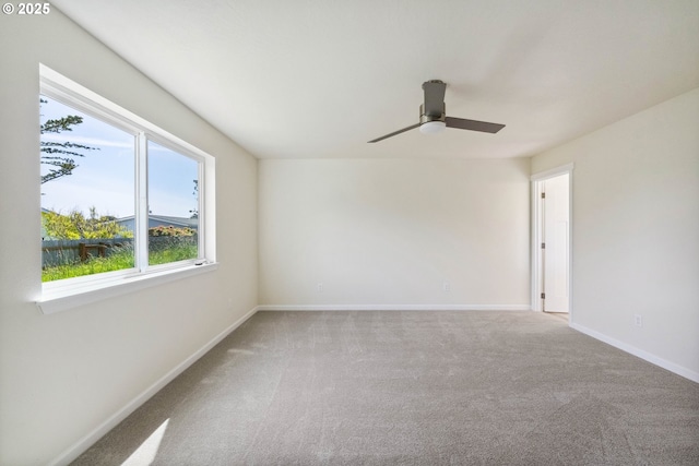 655 11th St SW, Bandon, OR 97411 - carpeted spare room featuring a ceiling fan and baseboards