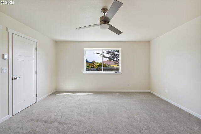 655 11th St SW, Bandon, OR 97411 - carpeted spare room featuring ceiling fan and baseboards