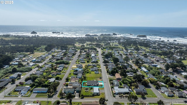 655 11th St SW, Bandon, OR 97411 - aerial overview of property's location with a large body of water, property boundaries highlighted, and nearby suburban area