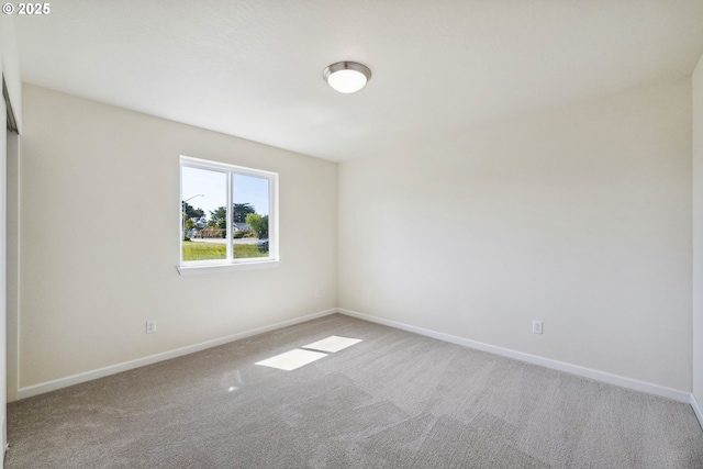 655 11th St SW, Bandon, OR 97411 - carpeted empty room featuring baseboards