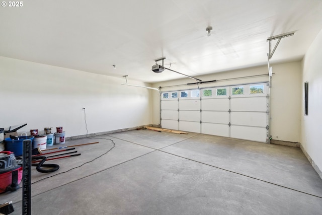 655 11th St SW, Bandon, OR 97411 - garage featuring a garage door opener