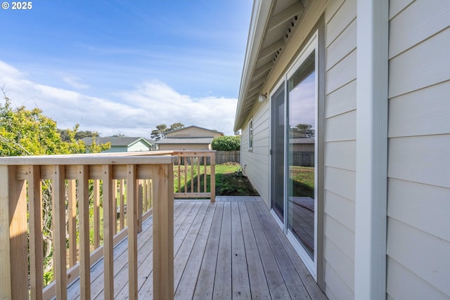 655 11th St SW, Bandon, OR 97411 - wooden terrace featuring a garage