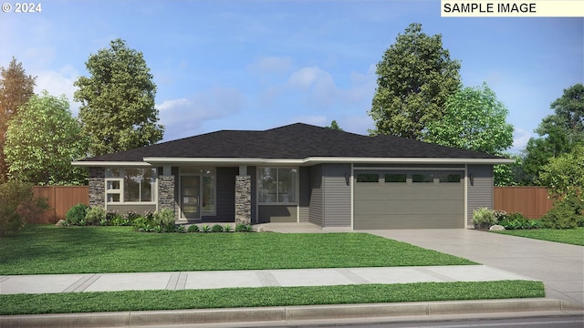 view of front of house with a front yard and a garage