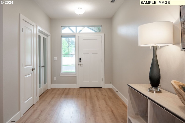 foyer with light hardwood / wood-style flooring