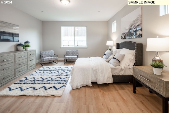 bedroom with light hardwood / wood-style flooring