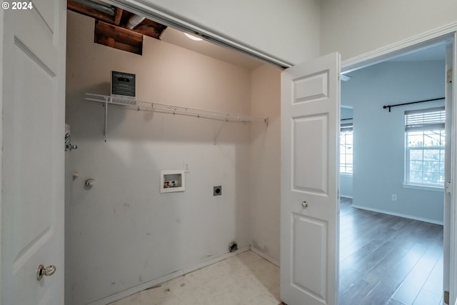 laundry room featuring washer hookup, light wood-type flooring, and electric dryer hookup